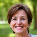 Retrato de María Fernández, una mujer sonriente de mediana edad